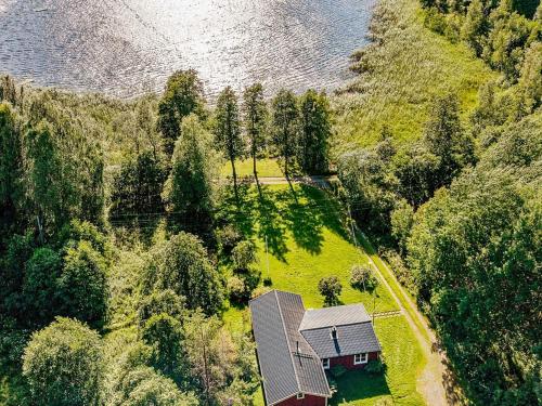 an aerial view of a house in the middle of a forest at 4 person holiday home in ASKERSUND-By Traum in Askersund
