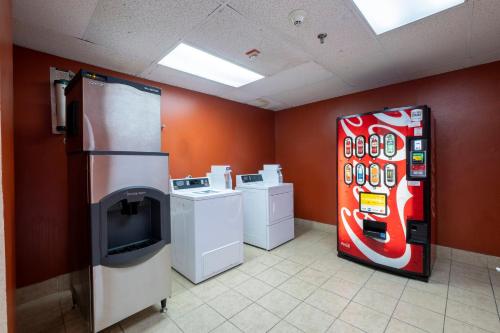 a room with a coke machine in a kitchen at Red Roof Inn and Suites Newark - University in Newark
