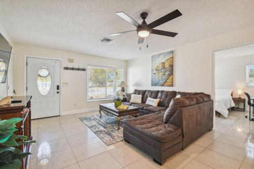 a living room with a couch and a ceiling fan at Home Near Weeki Wachee, King Bed, Huge Backyard in Spring Hill