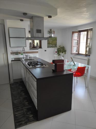 a kitchen with a black counter top in a room at CA' VERDEMARE in Varazze