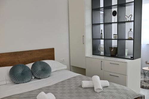 Postel nebo postele na pokoji v ubytování Golden Neretva apartments