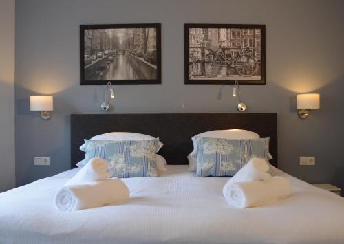Ένα ή περισσότερα κρεβάτια σε δωμάτιο στο Frisco Inn