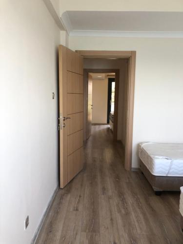 Ένα ή περισσότερα κρεβάτια σε δωμάτιο στο Seyran Seaside Apartments - 2-dublex