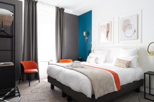 Oceania Hôtel d'Anjou Angersにあるベッド