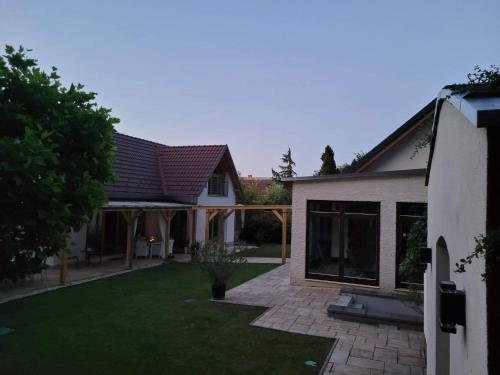 an image of a house with a yard at Villa Quality Wellness in Dozmat