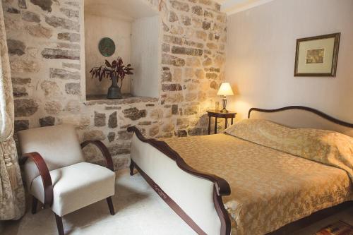 Voodi või voodid majutusasutuse Palazzo Radomiri Heritage Boutique Hotel toas