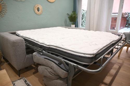Ένα ή περισσότερα κρεβάτια σε δωμάτιο στο Maison avec spa dans l'hyper centre de Poitiers