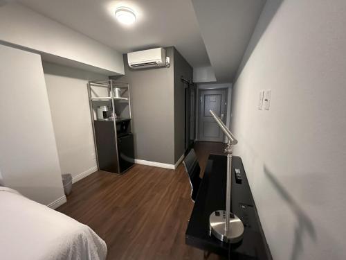 a bedroom with a bed and a desk with a lamp at Holiday Inn Express - Dallas Downtown by IHG in Dallas