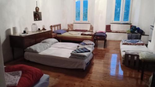 a living room with two beds and a couch at @gatetothewild in Coreglia Ligure