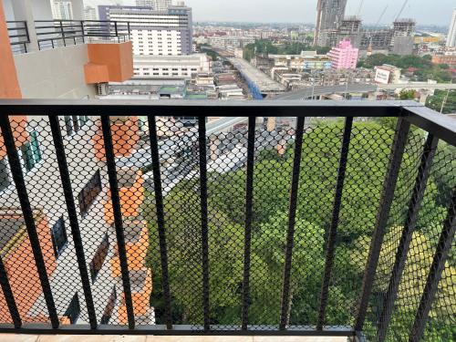 a balcony with a view of a city at Mall Suites Hotel in Bangkok