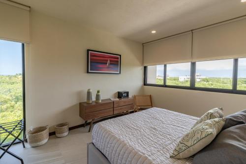 Ένα ή περισσότερα κρεβάτια σε δωμάτιο στο Ocean view 2BR Apartment Yum Balam