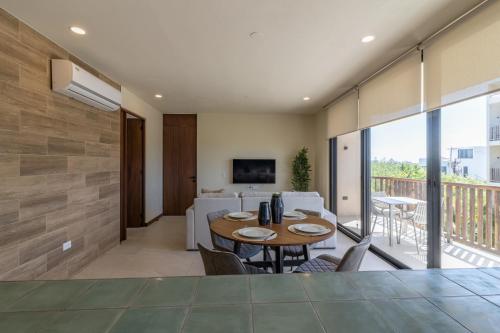 Μια τηλεόραση ή/και κέντρο ψυχαγωγίας στο Ocean view 2BR Apartment Yum Balam