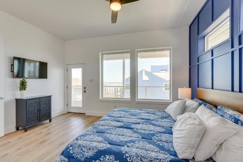 Un dormitorio con una cama y ventanas de color azul y blanco. en Modern Galveston Vacation Rental Steps to Beach!, en Galveston