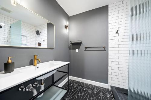 a bathroom with a sink and a shower at Wanderstay Boutique Hotel in Houston