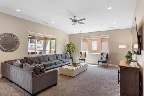 a living room with a couch and a table at Red Sand Hideaway #119 home in Santa Clara