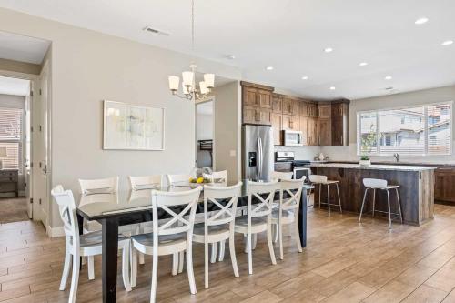 a kitchen and dining room with a table and chairs at Red Sand Hideaway #119 home in Santa Clara