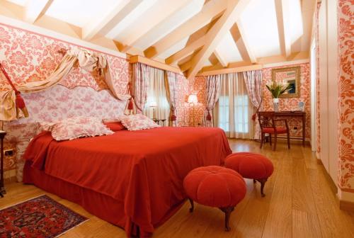 Säng eller sängar i ett rum på Hotel Palazzo Guiscardo