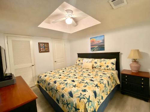 a bedroom with a bed and a ceiling fan at SunSwept 505 by ALBVR - Beachfront condo at a great location! in Orange Beach
