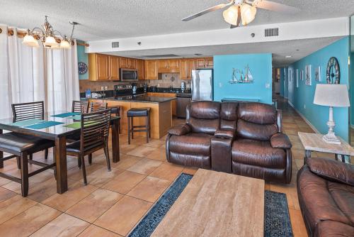 a living room with a couch and a table at Phoenix East 801 by ALBVR - Corner unit with wrap-around balcony and unparalleled views! in Orange Beach