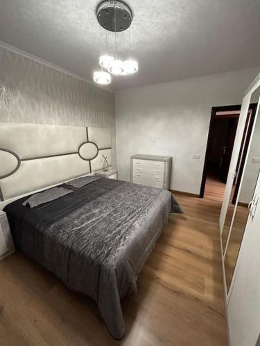 a bedroom with a large bed in a room at Sea-side Villa in la Zenia in Alicante