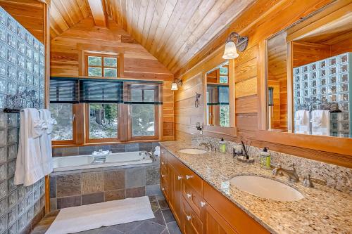 a bathroom with two sinks and a tub at Seattle Mountain Home in Snoqualmie Pass