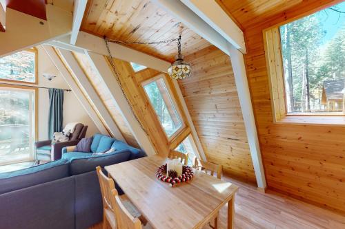 a dining room and living room of a tiny house at Peaceful Pine Getaway in Dorrington