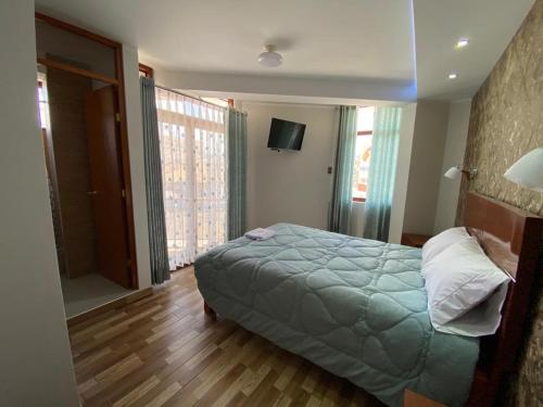A bed or beds in a room at EL GRAN SEÑORIAL