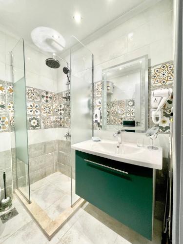 a bathroom with a sink and a shower at Luxury Studio House 589-1 in 6th Of October
