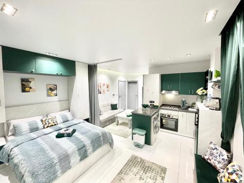 a large bedroom with a bed and a kitchen at Studio House 589-1 in 6th Of October