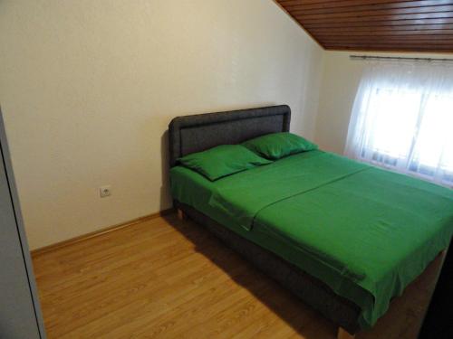 Кровать или кровати в номере Apartments Pribilovic