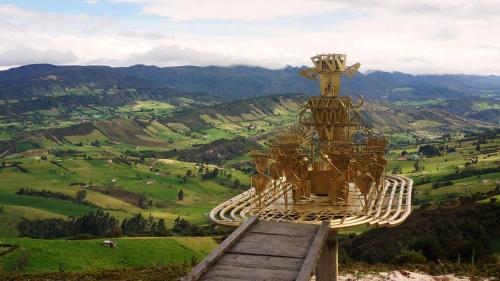 a building on top of a hill with a view at Kajú Mirador Guatavita in Guatavita