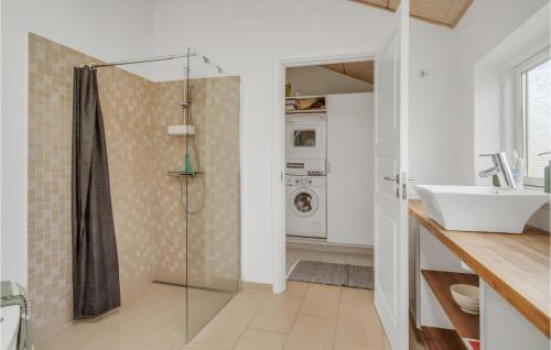 a bathroom with a shower and a sink at 3 Bedroom Nice Home In Sams in Nordby