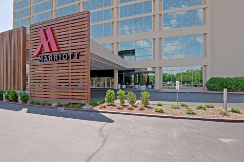 a building with a sign on the front of it at Tulsa Marriott Southern Hills in Tulsa