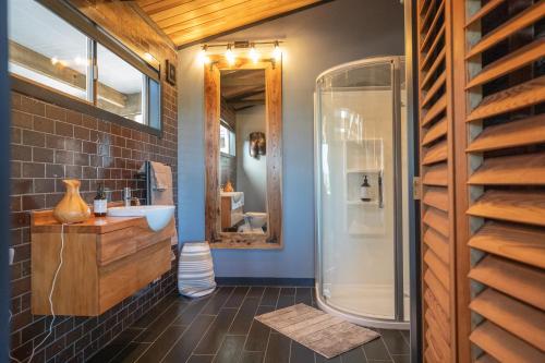 a bathroom with a sink and a shower at Holiday Bliss in Tirau