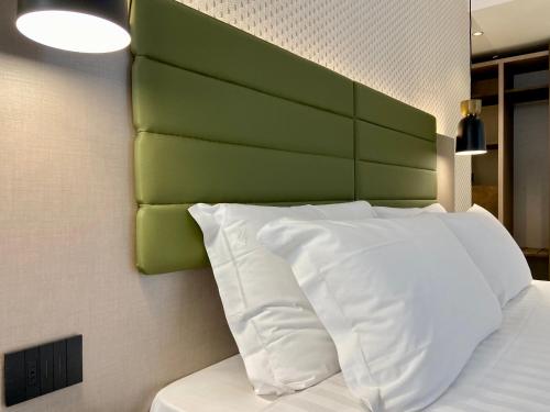 Katil atau katil-katil dalam bilik di Salemare Rooms & Suites