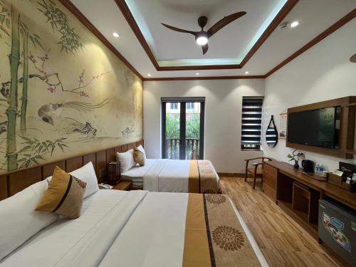 Postel nebo postele na pokoji v ubytování Samatha Hotel Bai Chay, Ha Long