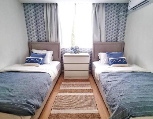 Postel nebo postele na pokoji v ubytování Astria Homes- your seaside home
