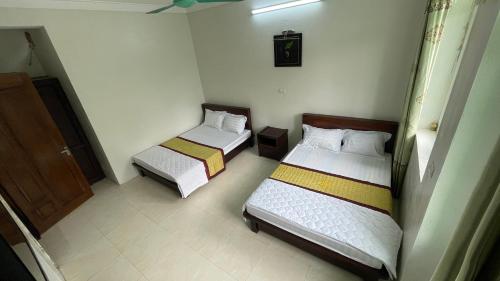 Giường trong phòng chung tại Sầm sơn star hotel