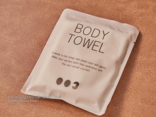 a white bag with the words body tower on it at First Cabin Nishi Umeda in Osaka