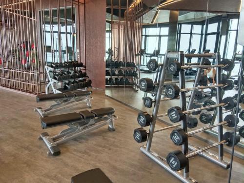 a gym with several rows of weight machines at Edge Central Pattaya Lux in Pattaya Central