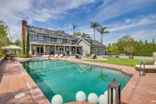 a home with a swimming pool and a house at Stunning Home in Orange County with Stables! in Orange