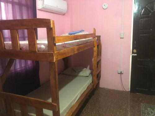 a bedroom with two bunk beds in a room at LP Madriaga Private Apt fully furnished w/Balcony in Ayusan Norte