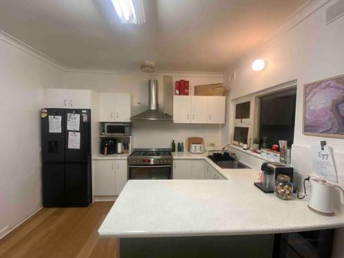 مطبخ أو مطبخ صغير في Holiday home in Torrens Park