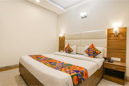a bedroom with two beds in a room at Hotel Leaf 9, Cyber City near Ambience Mall in Gurgaon