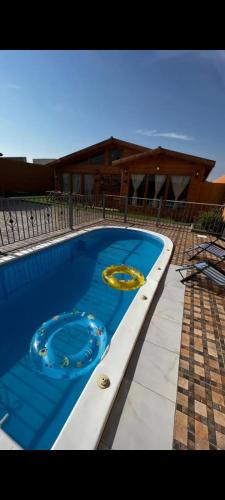 two frisbees are sitting in a swimming pool at شاليه الخفجي in Al Khafji