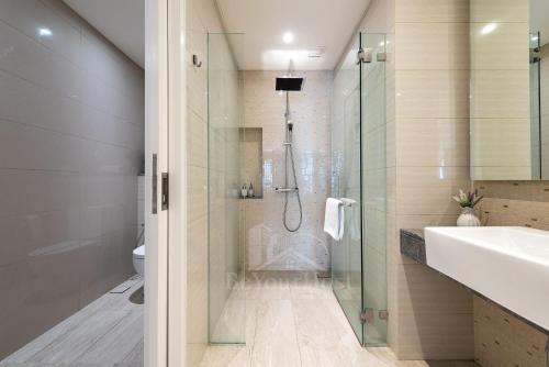 a bathroom with a shower and a sink at Anggun Residences Luxury Suites KL City Center in Kuala Lumpur