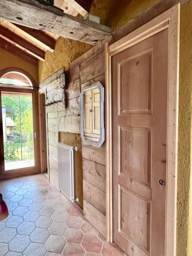 a door in a room with a stone wall at Casa Unica- da Bruno in Colico