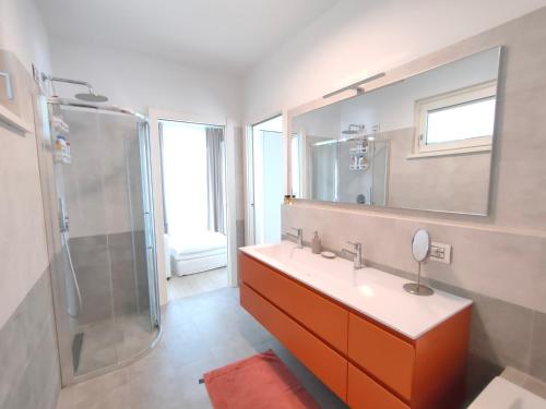 a bathroom with a sink and a shower at IseoLakeRental - Blue Note in Solto Collina