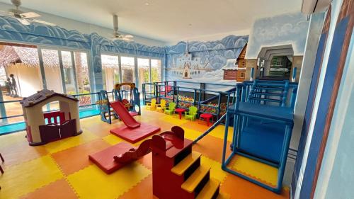 a room with a play room with a playground at Coco Grove Beach Resort, Siquijor Island in Siquijor