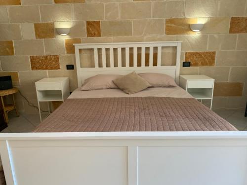 Säng eller sängar i ett rum på Apt Riviera degli Haethey